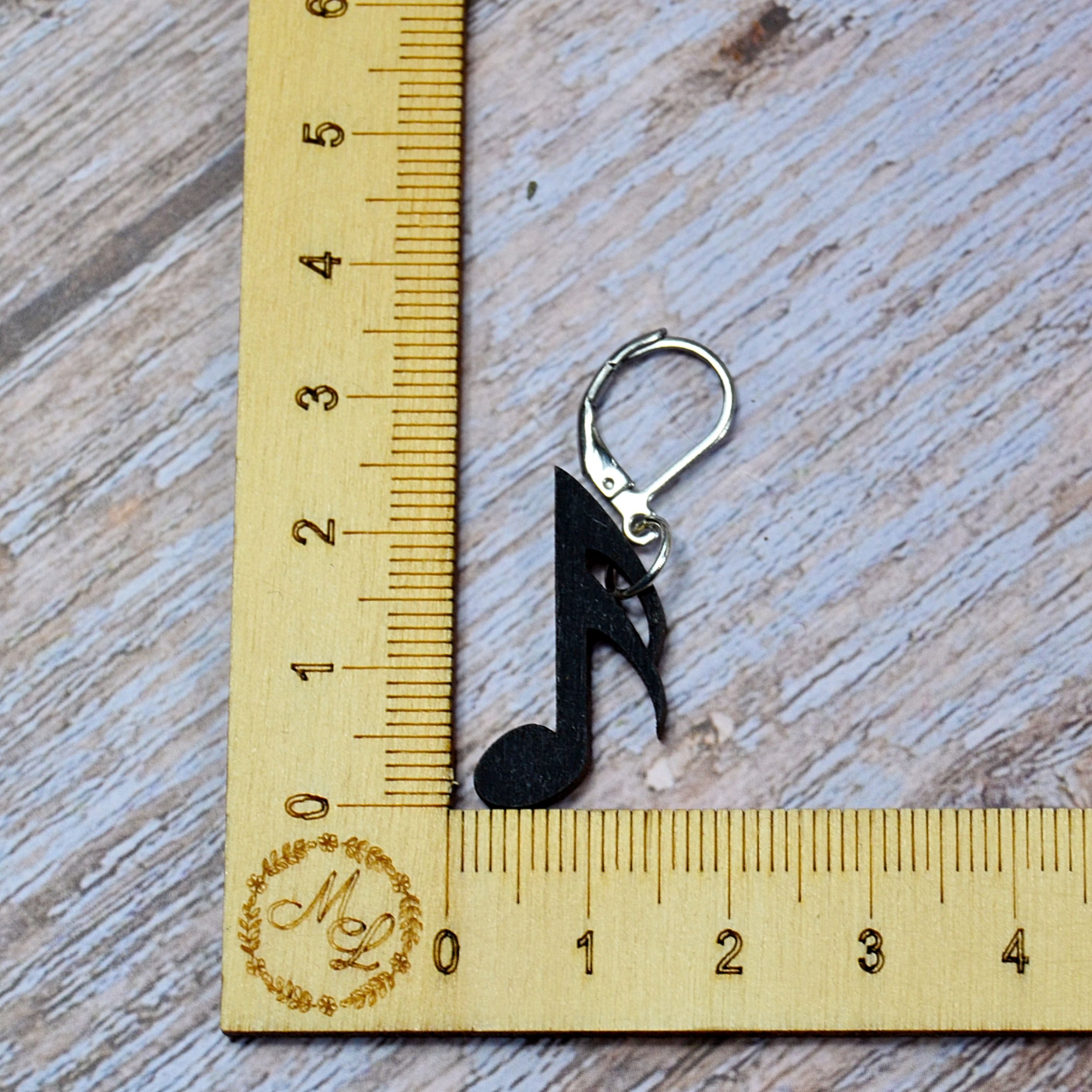 Holzmaschenmarkierer Musiknote an Lineal

