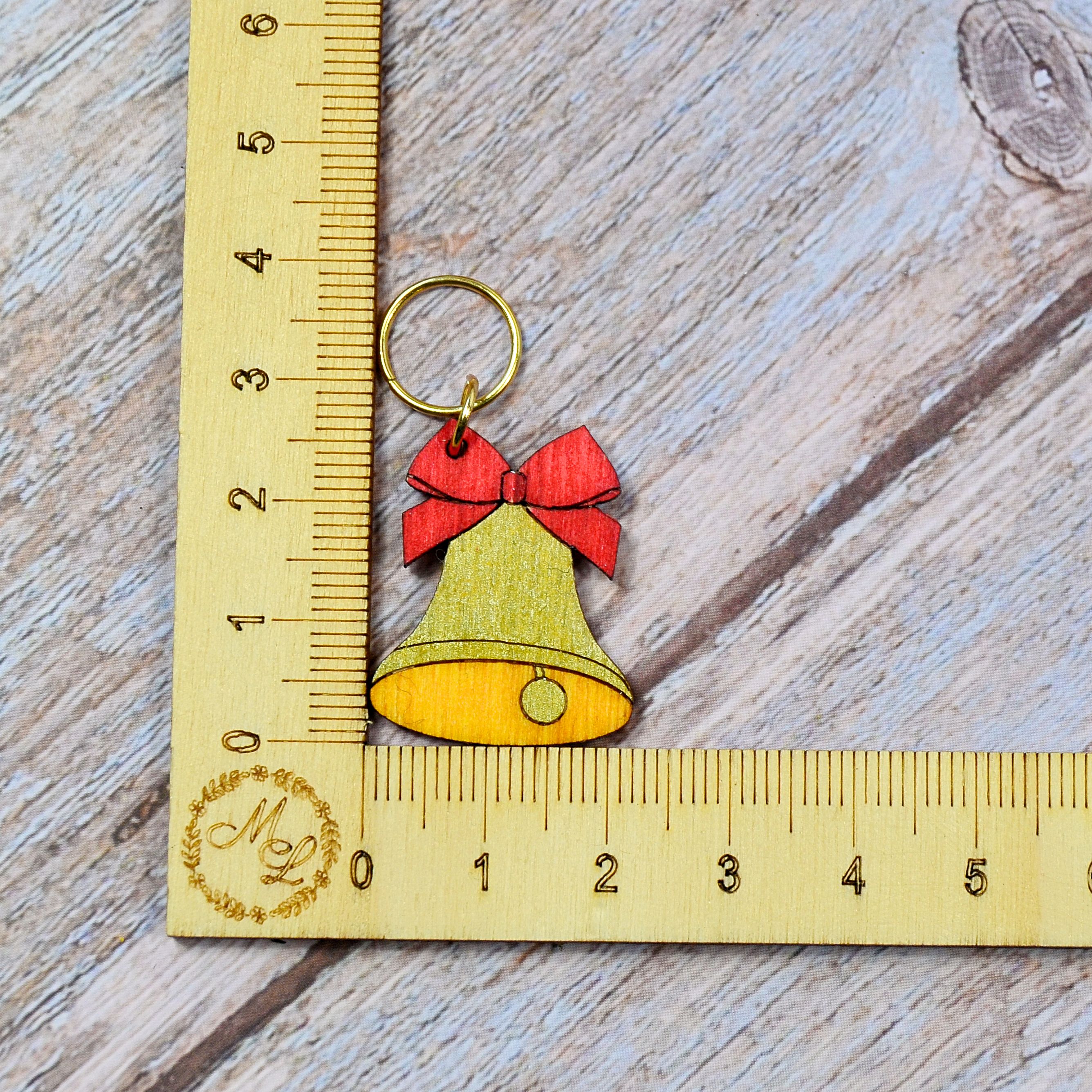 Holzmaschenmarkierer Weihnachtsglocke
 an Lineal